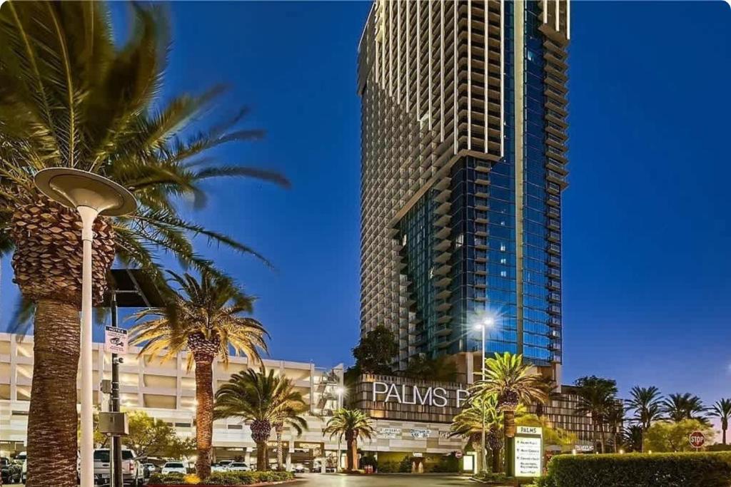 a tall building with palm trees in front of it at Palms Place in Las Vegas