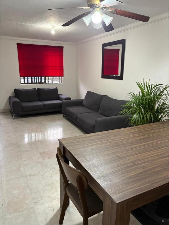 a living room with a couch and a table at House in Monterrey Nuevo León in Monterrey