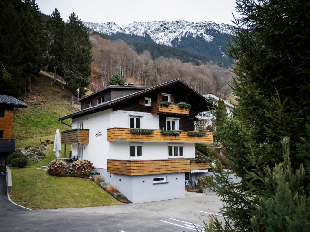 a house with wooden balconies on the side of it at Haus Tisch in Schruns