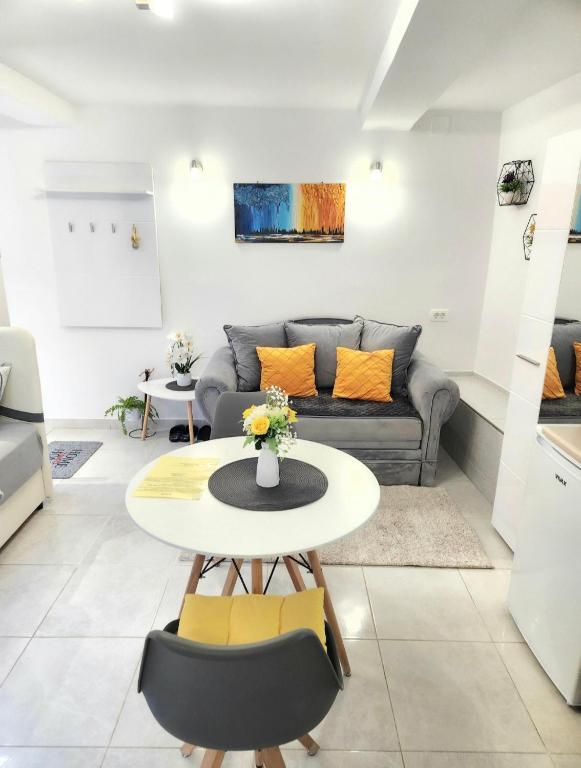a living room with a table and a couch at Apartment Marina in Kotor