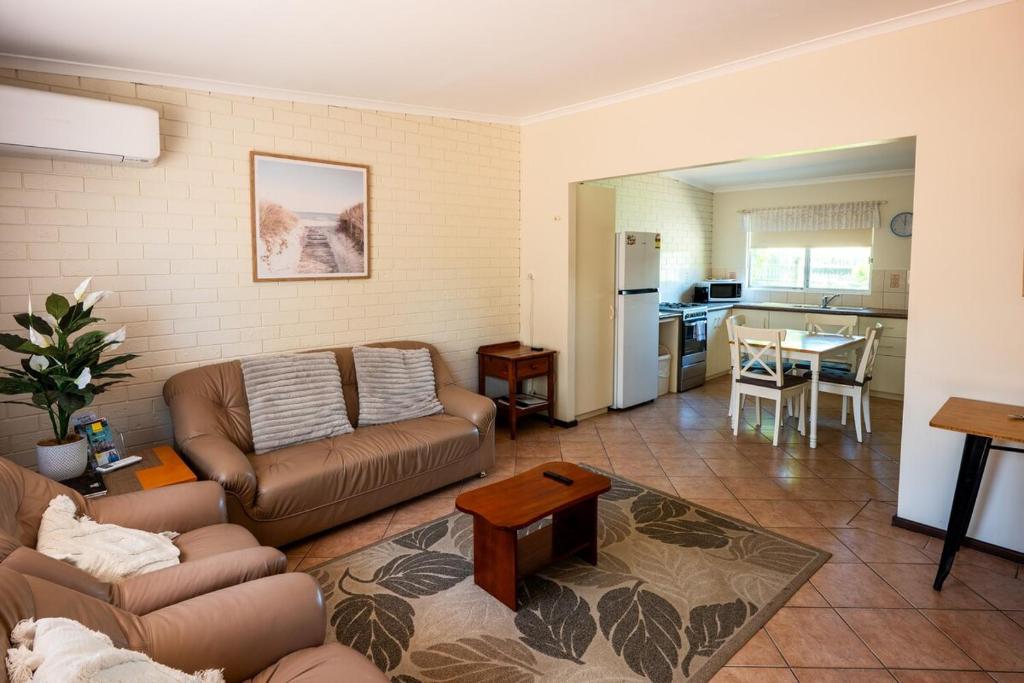 a living room with a couch and a table at Middleton Mews in Albany