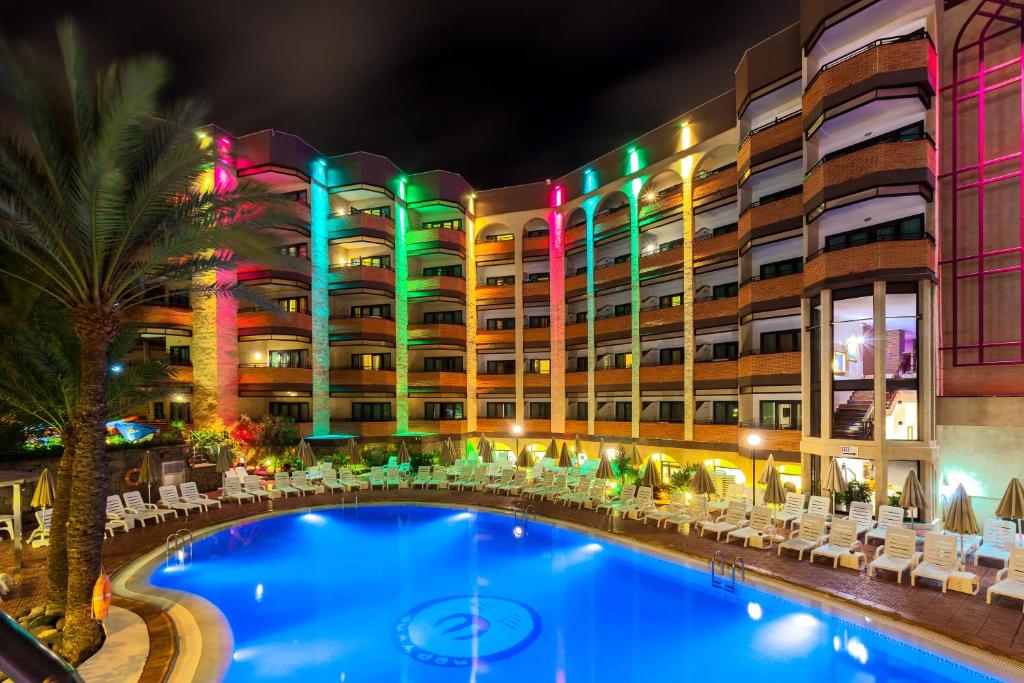 a large swimming pool in front of a large building at MUR Neptuno Gran Canaria - Adults Only in Playa del Ingles