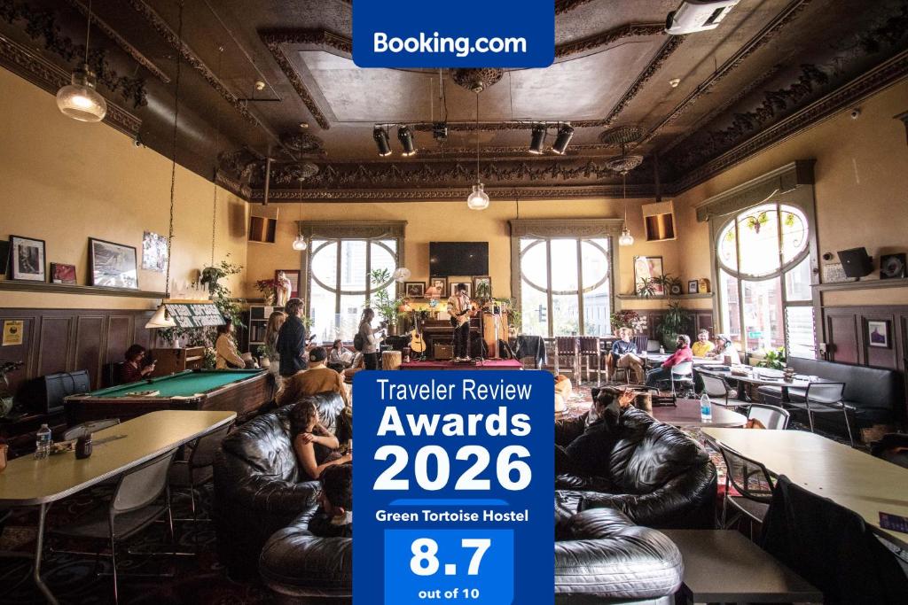 a restaurant with a sign that reads travel review awards at Green Tortoise Hostel in San Francisco
