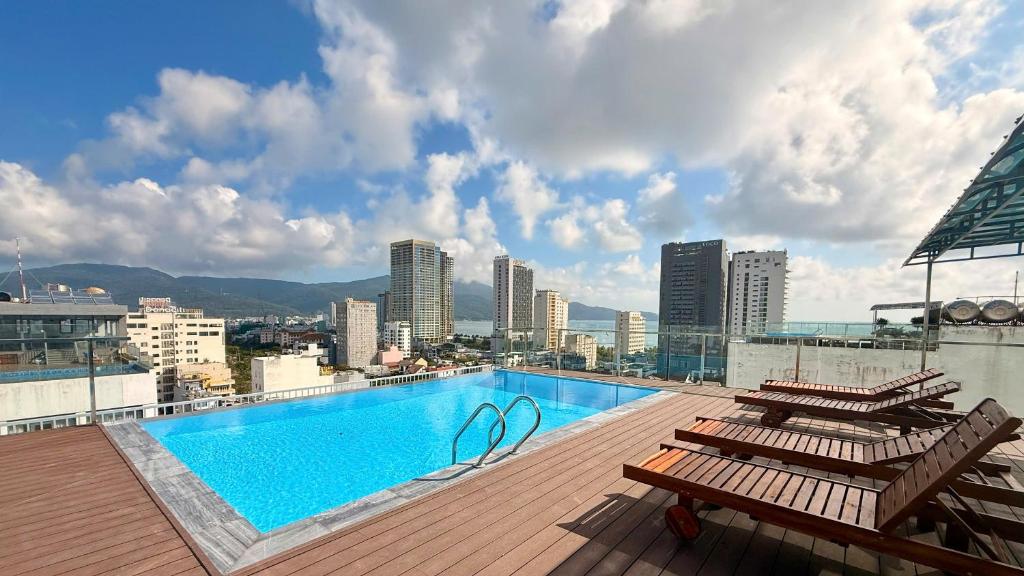 a swimming pool on the roof of a building at Golden Rose Hotel in Danang