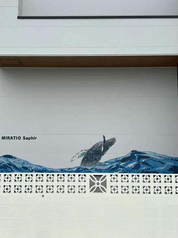 a painting of a dolphin on a wall at MIRATIO Saphir in Onna