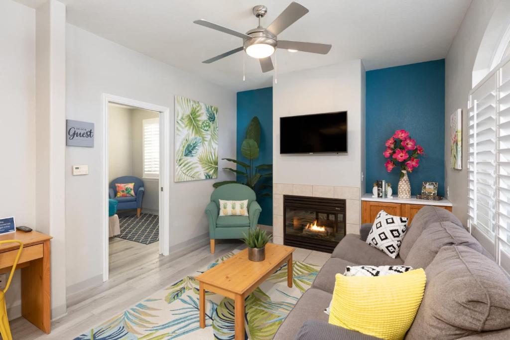 a living room with a couch and a fireplace at Seaside Flamingo Retreat in Oceano