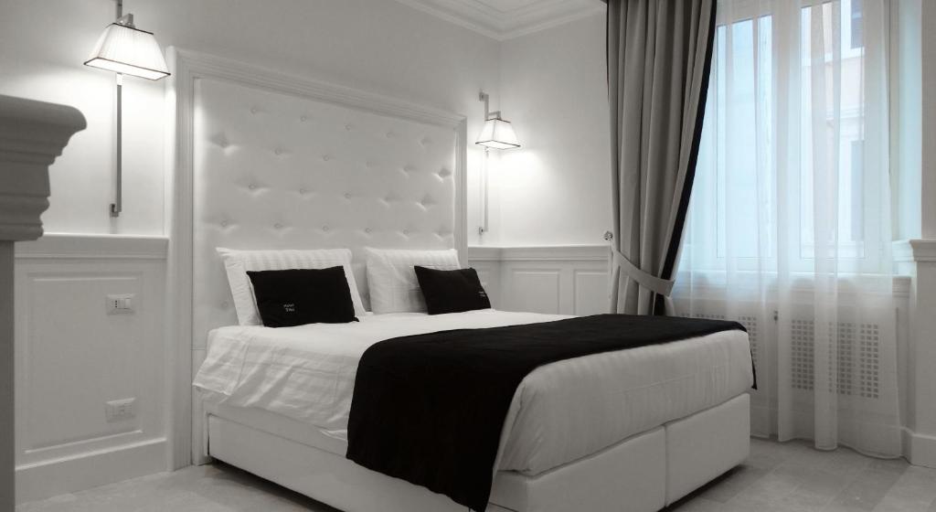 Postel nebo postele na pokoji v ubytování Hotel Tito