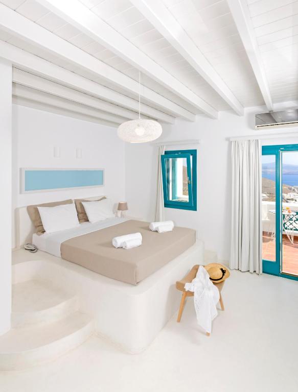 Postel nebo postele na pokoji v ubytování Astypalaia Hotel Palace