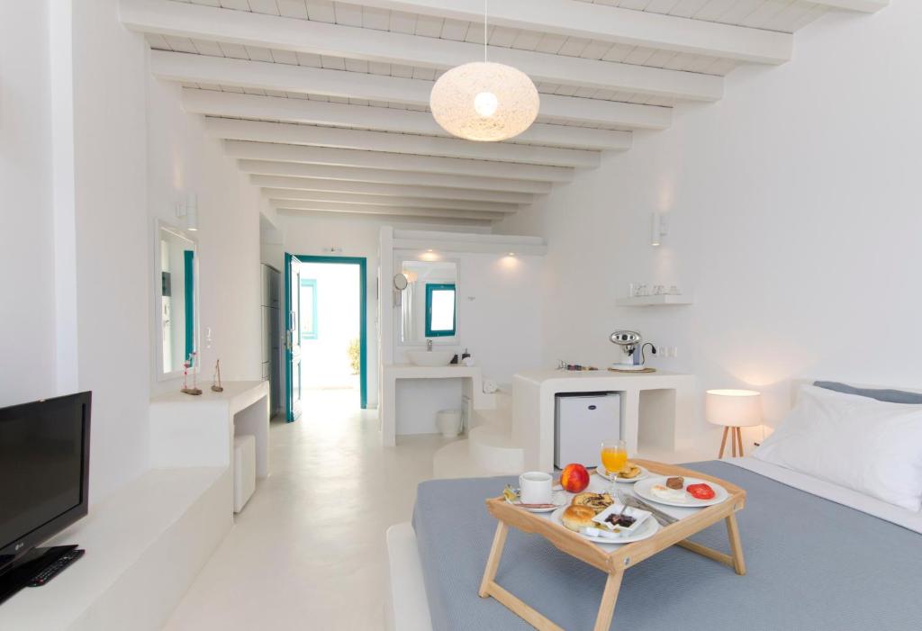 TV a/nebo společenská místnost v ubytování Astypalaia Hotel Palace
