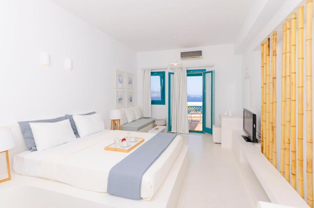 Postel nebo postele na pokoji v ubytování Astypalaia Hotel Palace