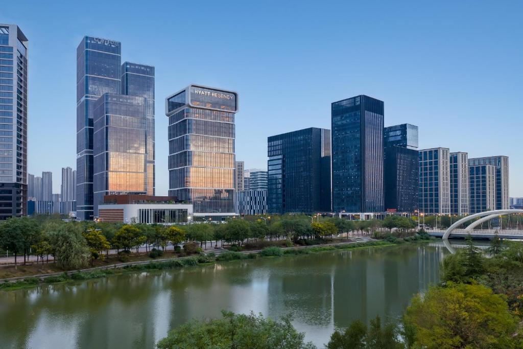 a river in front of a city with tall buildings at Hyatt Regency Xi'An Chanba in Xi'an