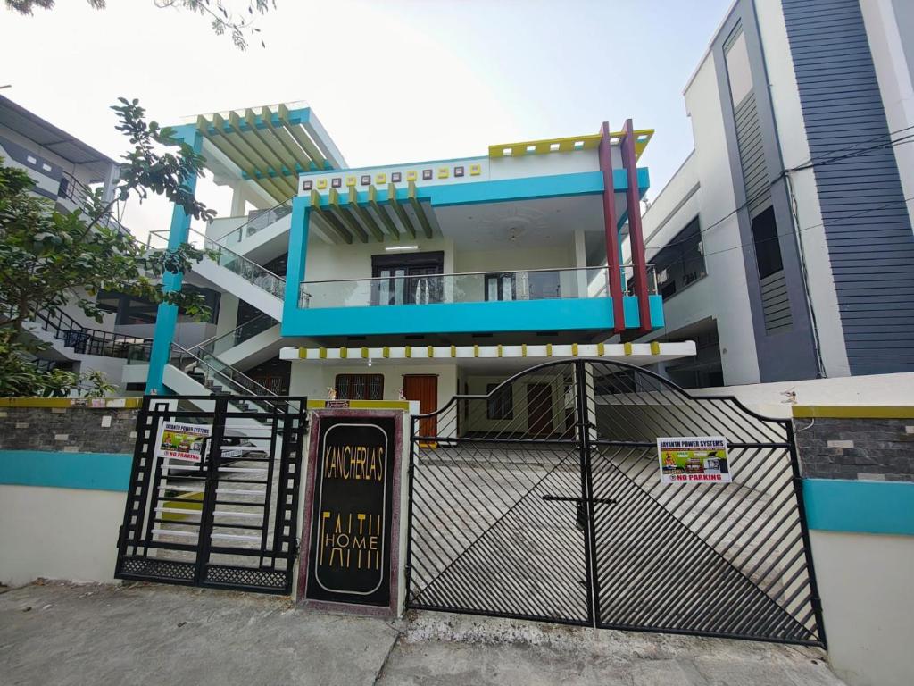 a building with a gate in front of it at Elixir Mansion in Pālakollu