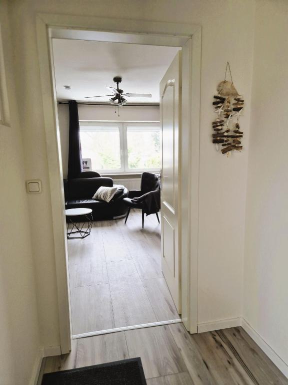 an open door to a room with a living room at Nordlandgiebel in Rosengarten