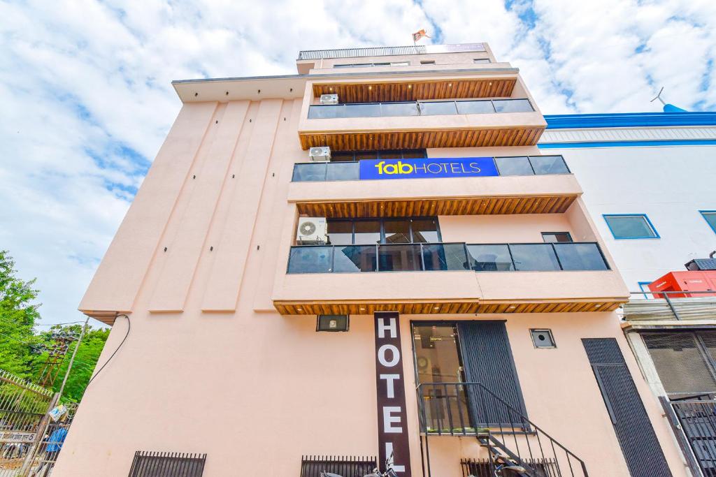 a building with the io hotels sign on it at FabHotel Blooming Beds Pearl in Jaipur