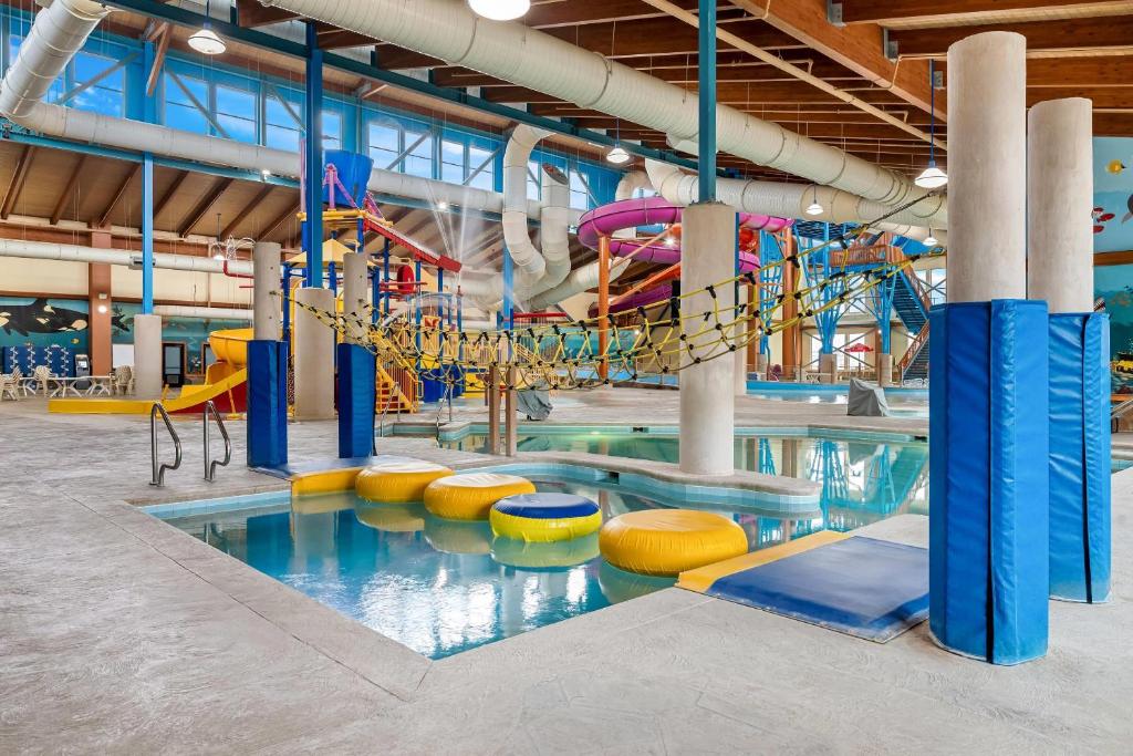 a large indoor swimming pool with a playground at Big Horn Resort, an Ascend Collection Hotel in Billings