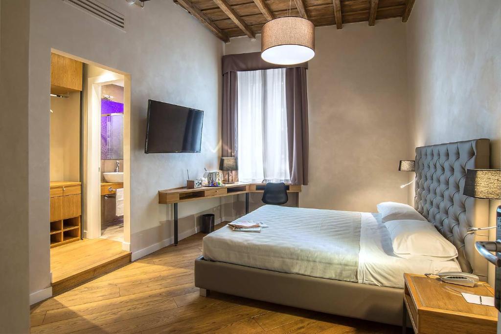 Postel nebo postele na pokoji v ubytování Hotel Elite