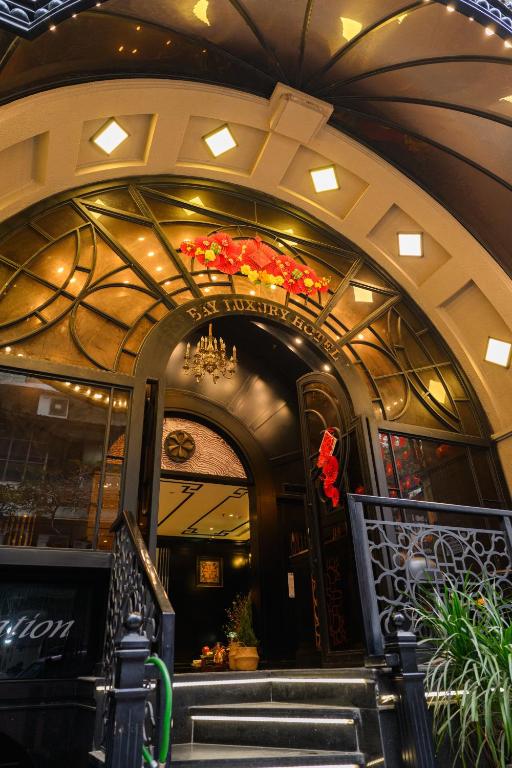 an entrance to a restaurant with a chandelier at Bay Luxury Fortune Grand Hotel in Hanoi