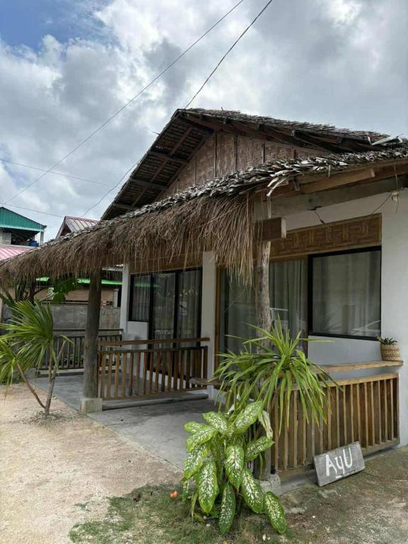 a small house with a thatched roof at Ayu Homestay in San Isidro