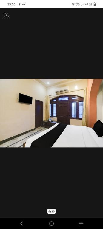 a picture of a bedroom with two beds at Hotel Pink Haveli in Jaipur