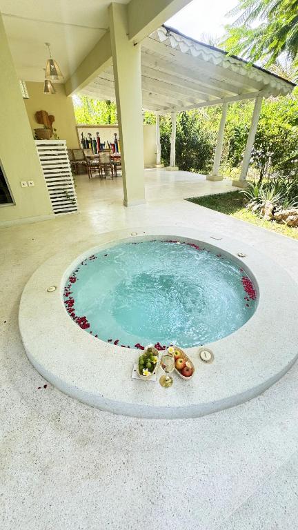 a swimming pool in the middle of a house at Villa Rebecca 1 at Paparemo Village in Watamu