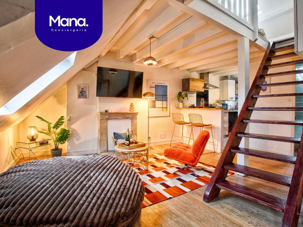 a loft conversion with a staircase and a living room at La Cime - Duplex hypercentre, Wi-Fi & restaurant in Caen