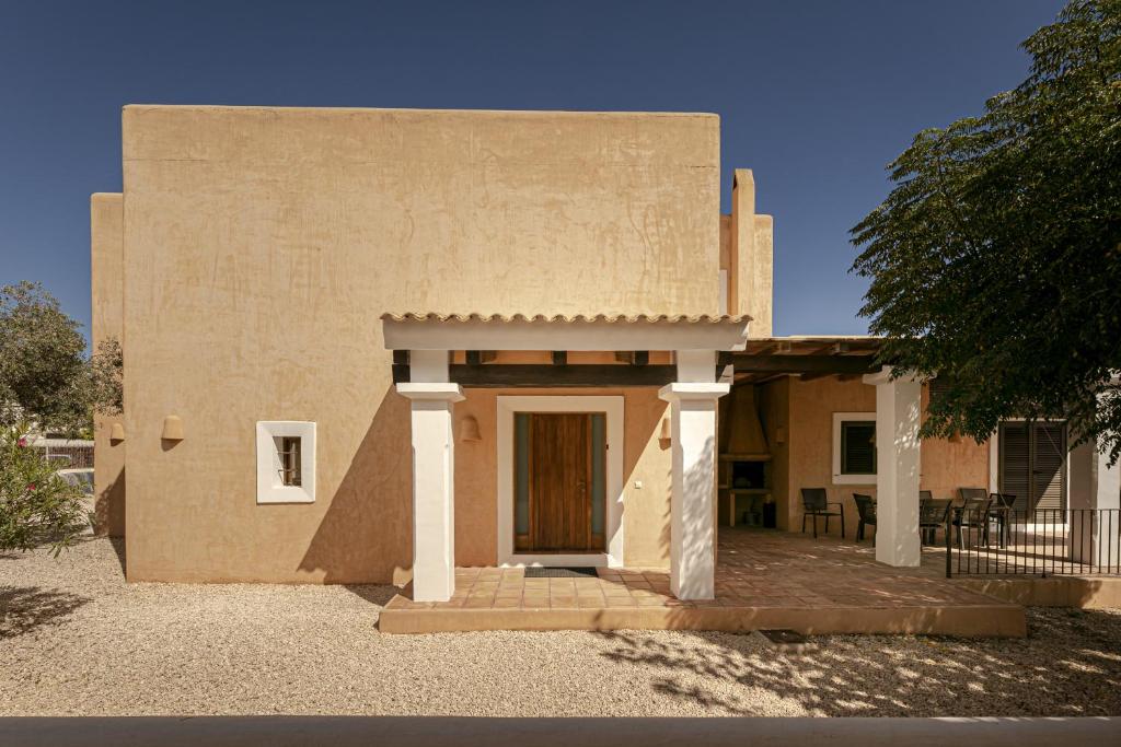 a small building with a door and a porch at CAN NOVES - Villa de 5 suites 58 y 15 in Sant Francesc Xavier