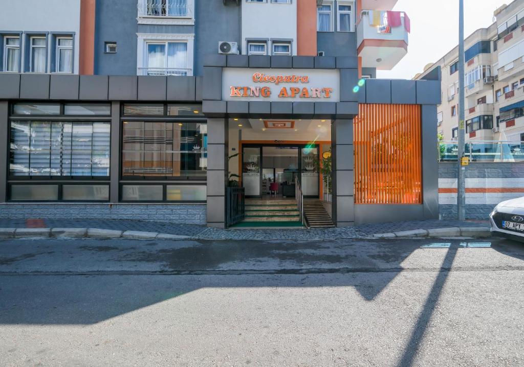 a large building with a sign that reads sing arena at Cleopatra King Apart in Alanya