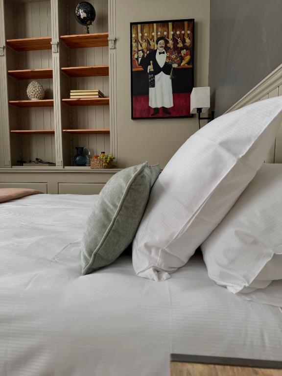 a bedroom with two pillows on a white bed at Villa Dolce in Silly