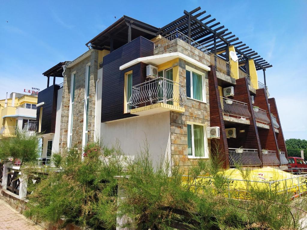a building with balconies on the side of it at Family Hotel Littoral in Sozopol