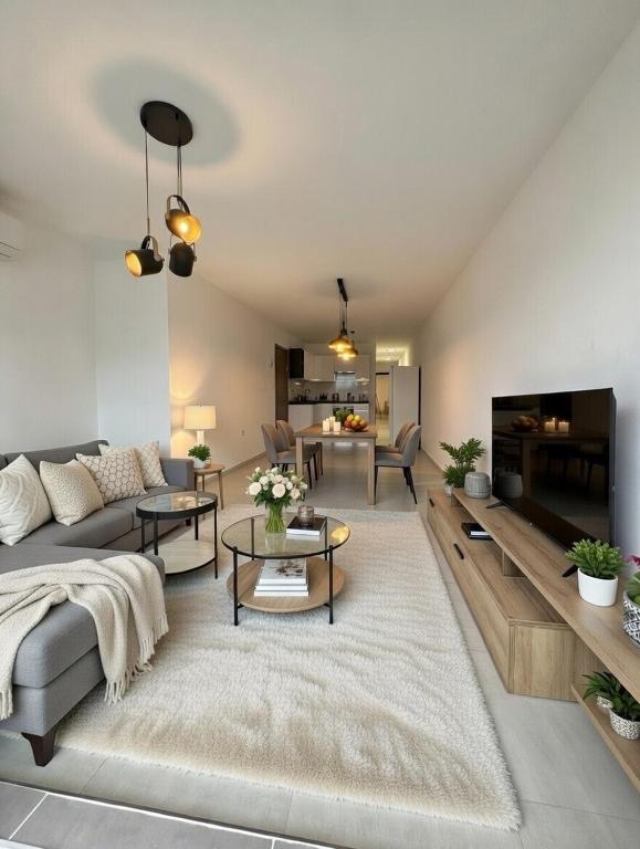 a living room with a couch and a table at Marina District in Pieta