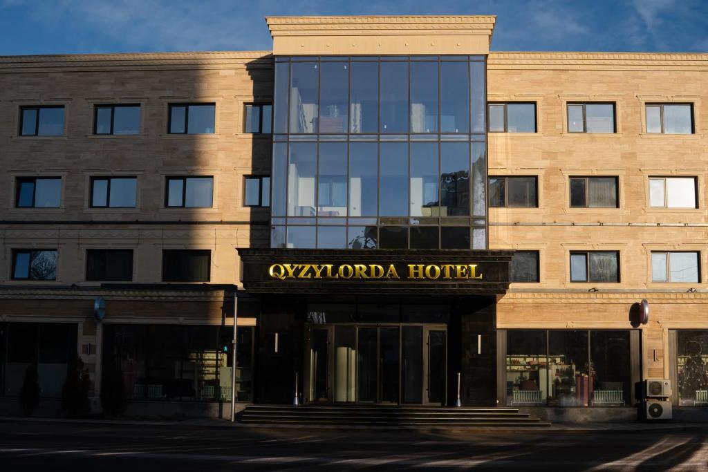 a building with a sign that reads oxytropha hotel at Qyzylorda Hotel in Kyzylorda