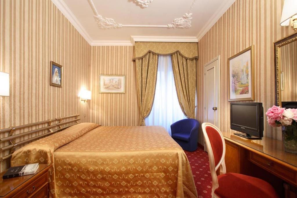 TV a/nebo společenská místnost v ubytování Hotel Eliseo