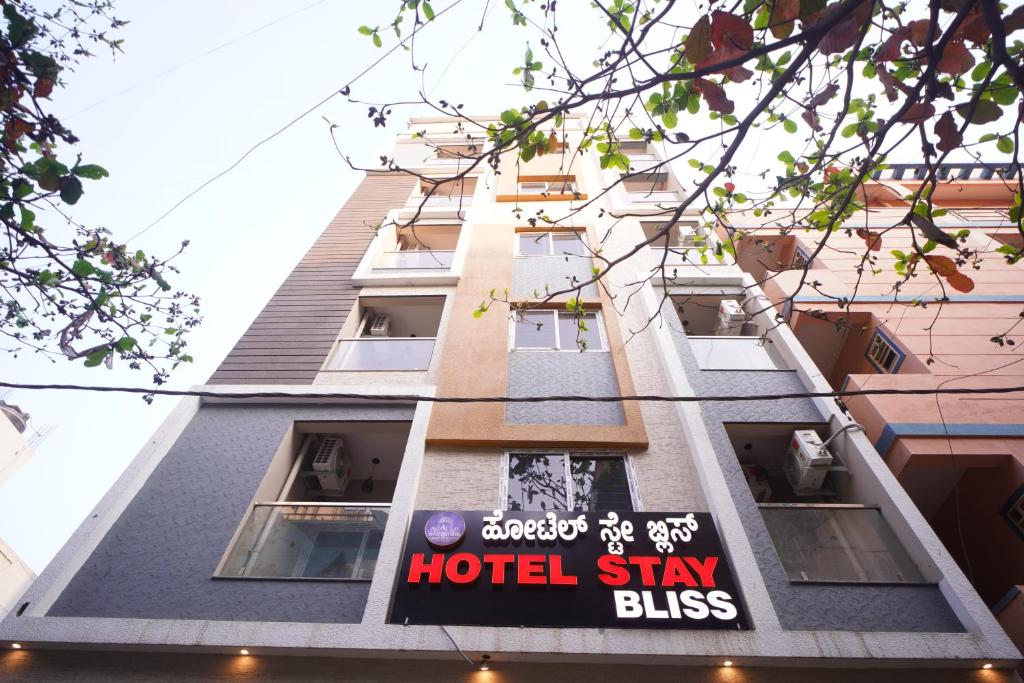 a hotel sign on the side of a building at Hotel Stay Bliss Marathahalli in Bangalore