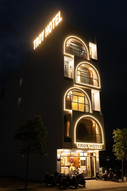 a hotel building with a tory hotel sign at night at TROY HOTEL - Bà Rịa in Ấp Long Kiên I