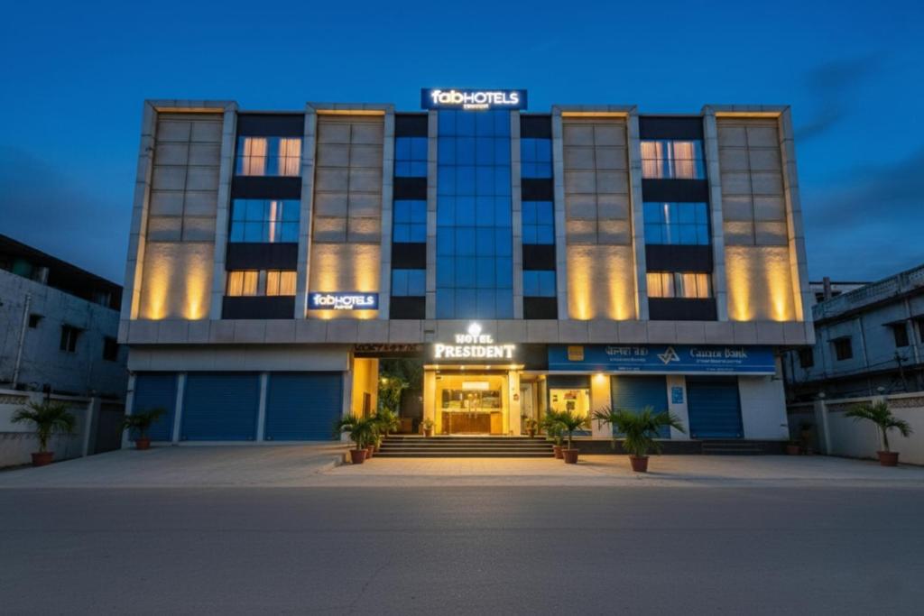 a building with a sign on the front of it at FabHotel Prime President in Bhopal