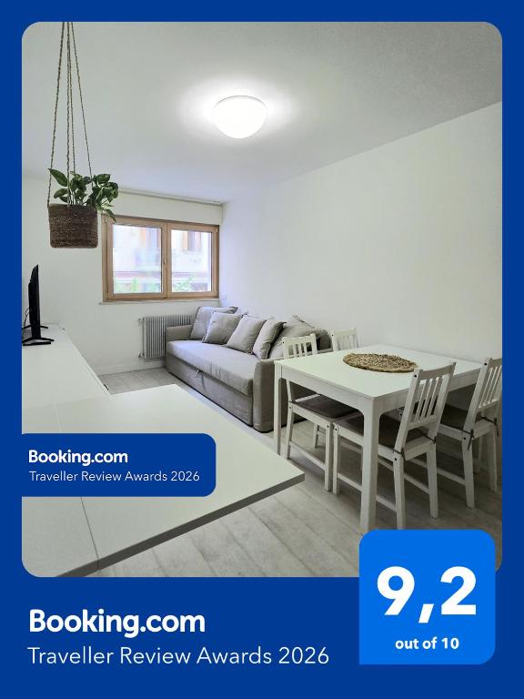 a living room with a couch and a table at Walsimar2 - Passi dalla spiaggia in Grado