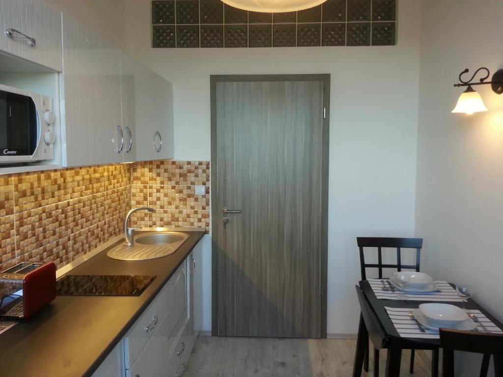 A kitchen or kitchenette at Downtown Apartment Miskolc