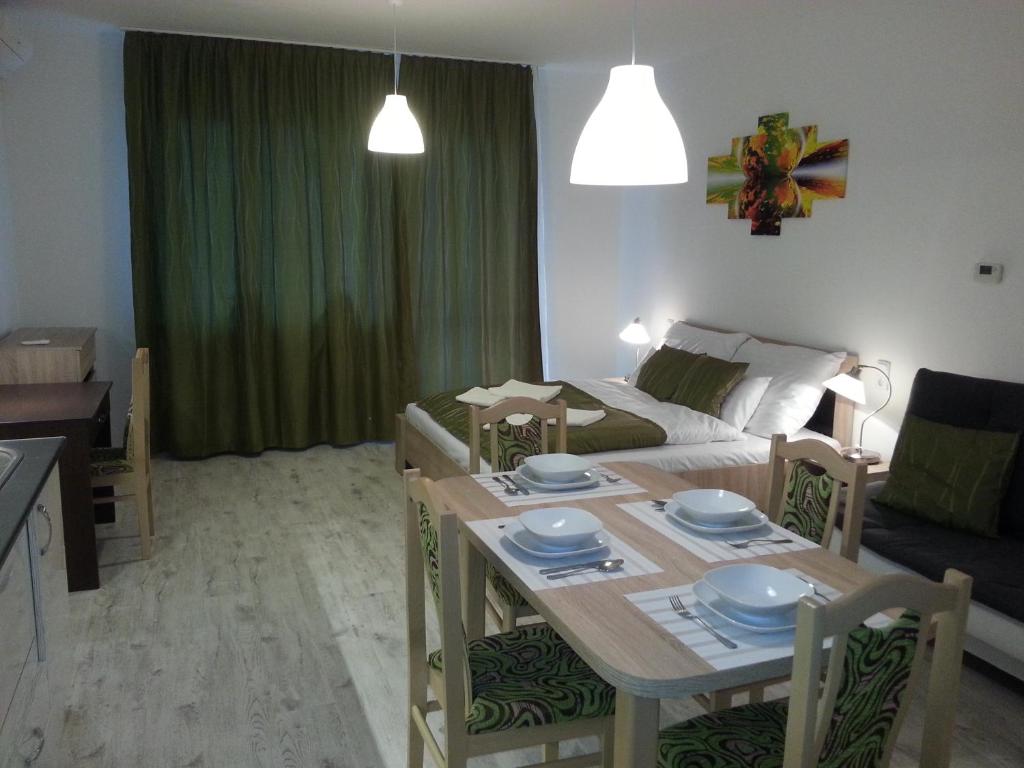 A television and/or entertainment centre at Downtown Apartment Miskolc