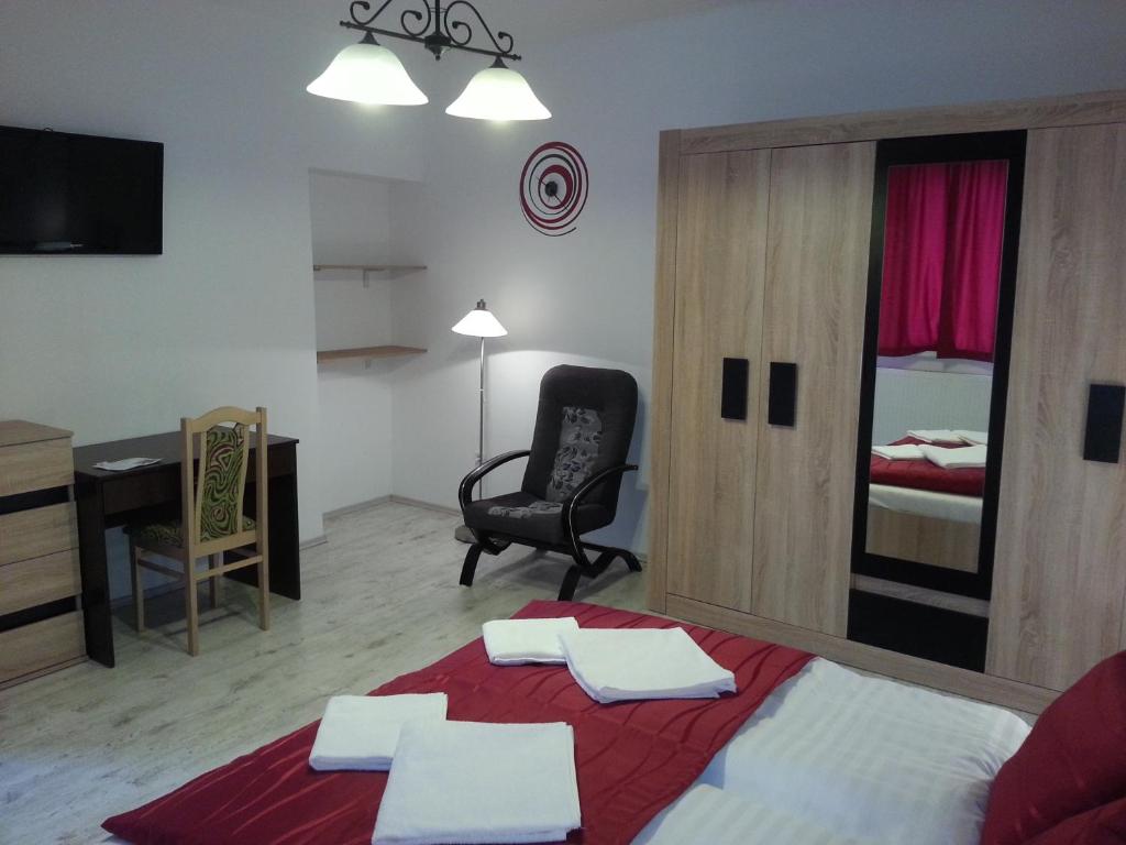 A bed or beds in a room at Downtown Apartment Miskolc