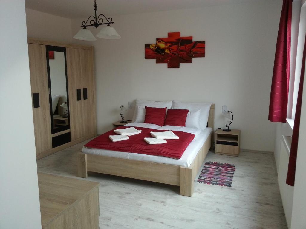 A bed or beds in a room at Downtown Apartment Miskolc
