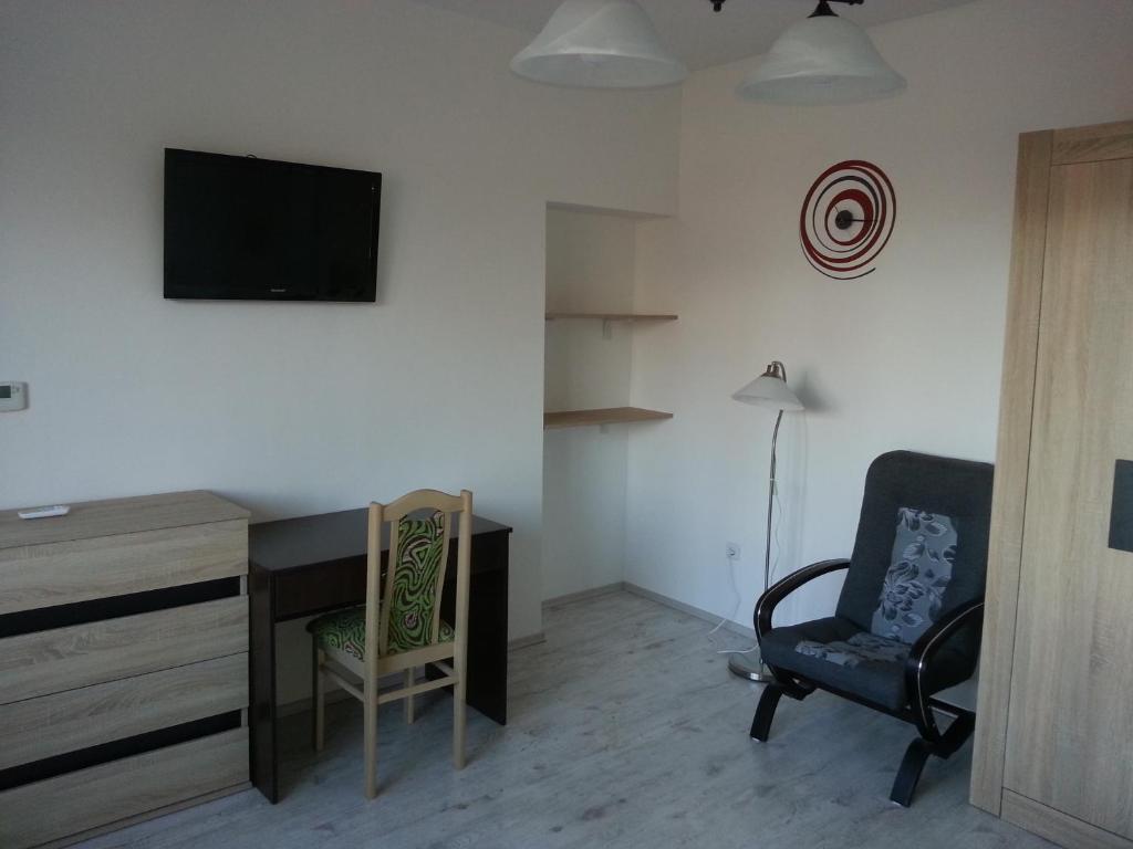 A television and/or entertainment centre at Downtown Apartment Miskolc