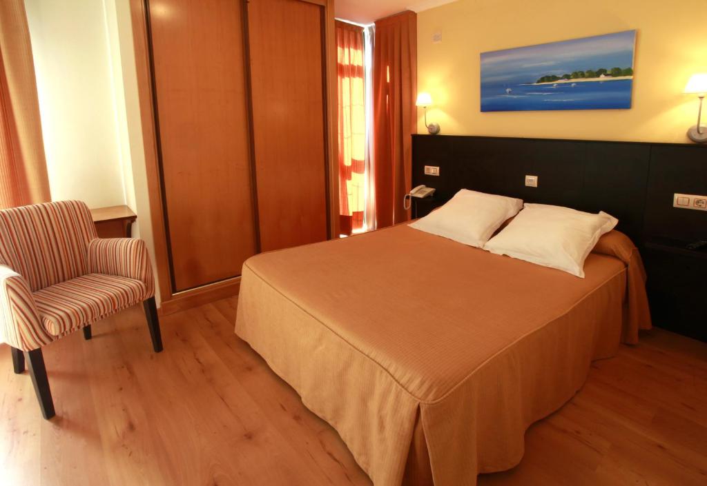 Posteľ alebo postele v izbe v ubytovaní Habitat Cm Muxia