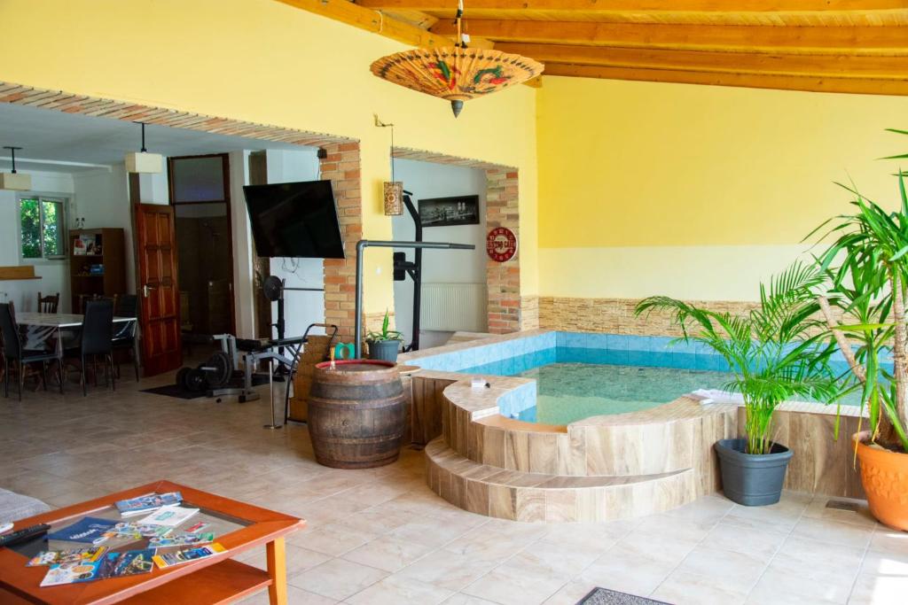 a living room with a jacuzzi in a house at AB Holiday Home in Siófok