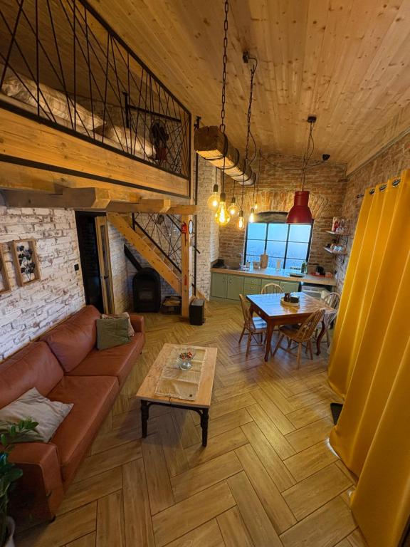 a living room with a couch and a table at Apartmán u Ondrika in Spišské Tomášovce
