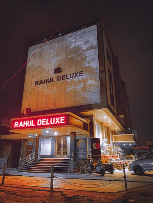 a building with a sign that reads raisin deluce at Hotel Rahul Deluxe in Nagpur