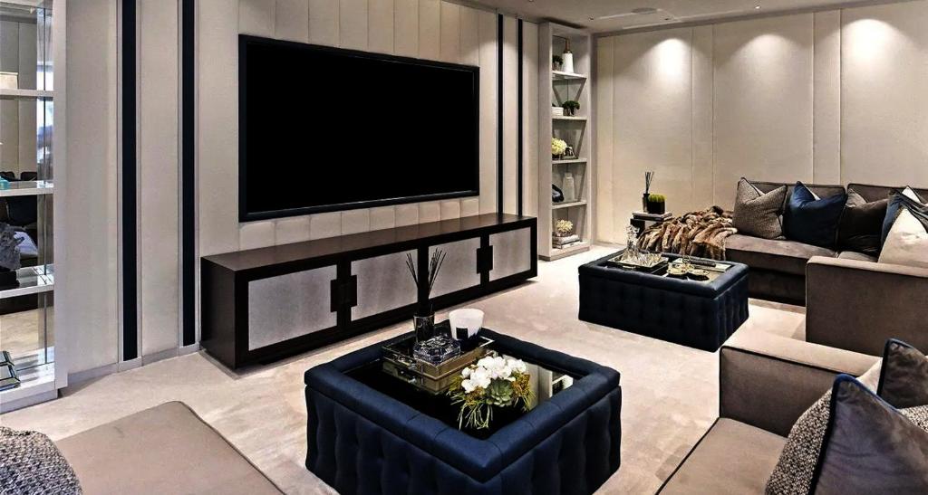 a living room with a tv on a wall at Kos blue & green in Kos