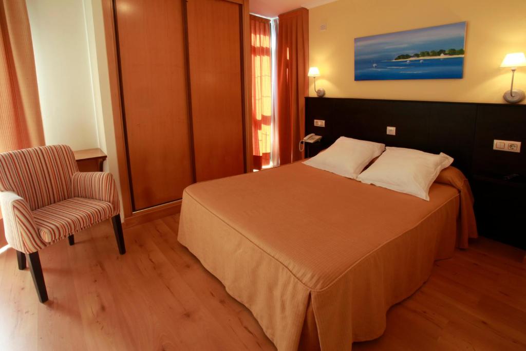 Posteľ alebo postele v izbe v ubytovaní Habitat Cm Muxia