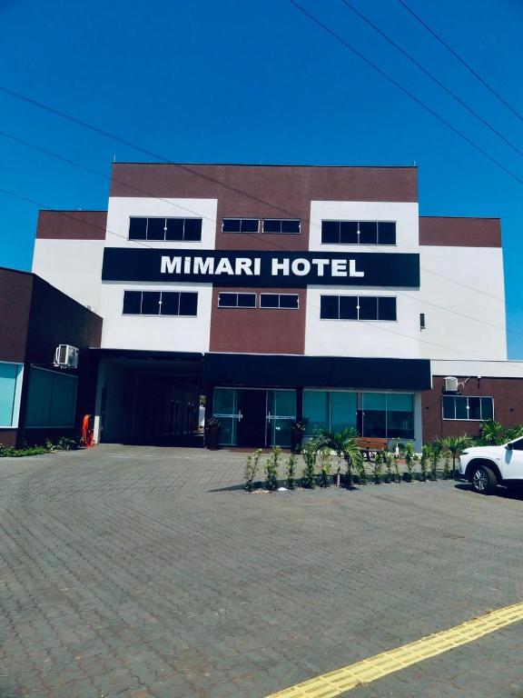 a hotel with a car parked in front of it at Mimari Hotel in Tangara da Serra