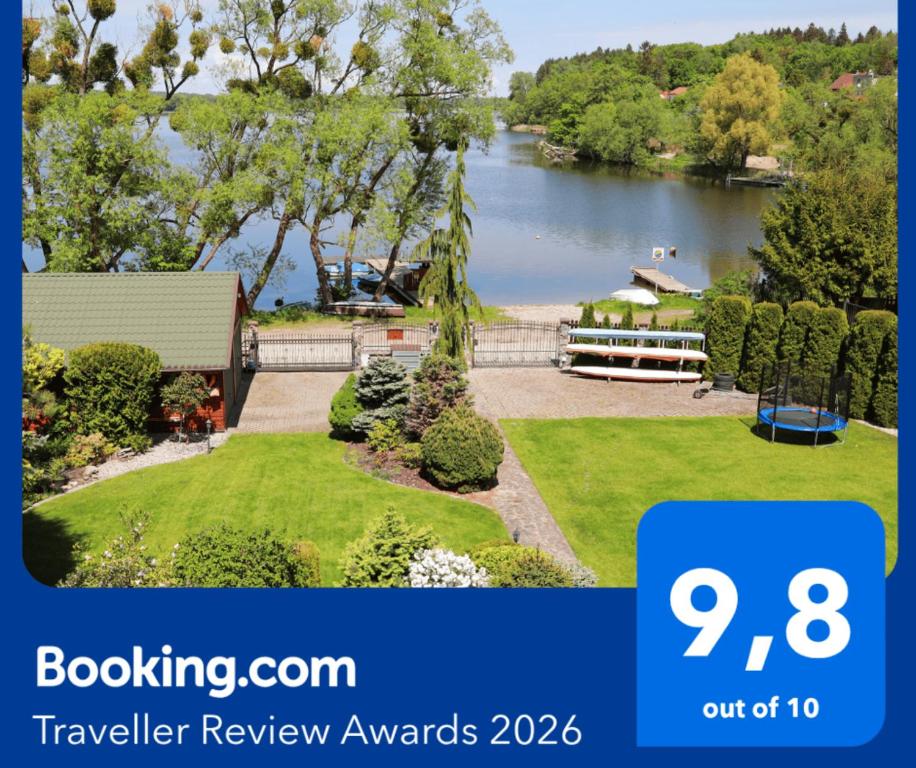 an image of a house with a view of a lake at Go Mazury in Mrągowo