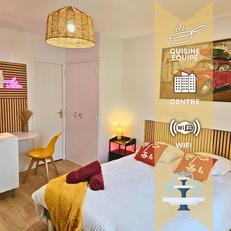 a bedroom with a bed and a dining room table at ''Coccinelle'' WIFI - CENTRE - MODERNE in Dax